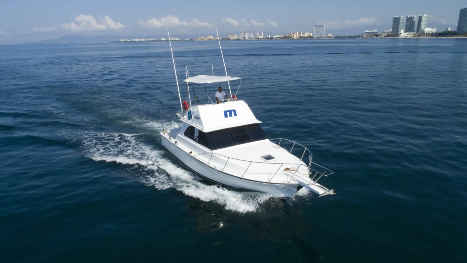 Private yacht charter cruising Banderas Bay toward Los Arcos and Yelapa